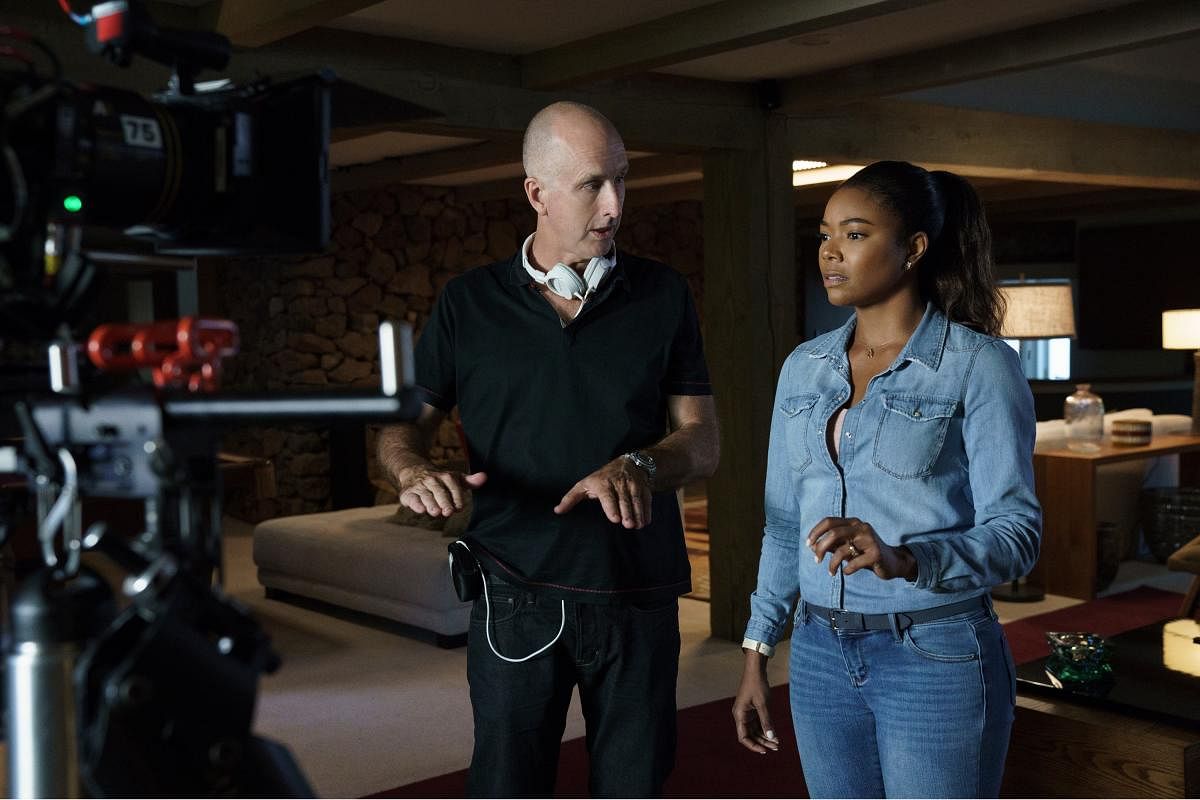 Director James McTeigue and actor Gabrielle Union on the sets of ‘Breaking In’.