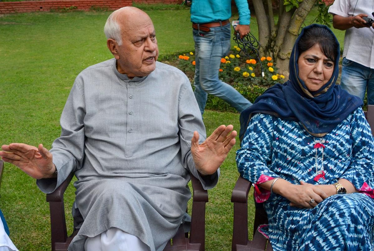 Srinagar: National Conference President Farooq Abdullah and former chief minister and PDP President Mehbooba Mufti during an all parties meeting. (PTI Photo)