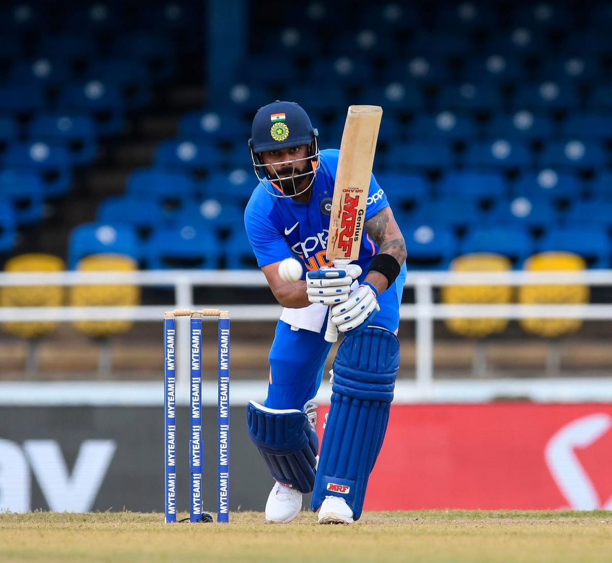 Virat Kohli hits a boundary during the second ODI match between West Indies and India. (AFP photo)