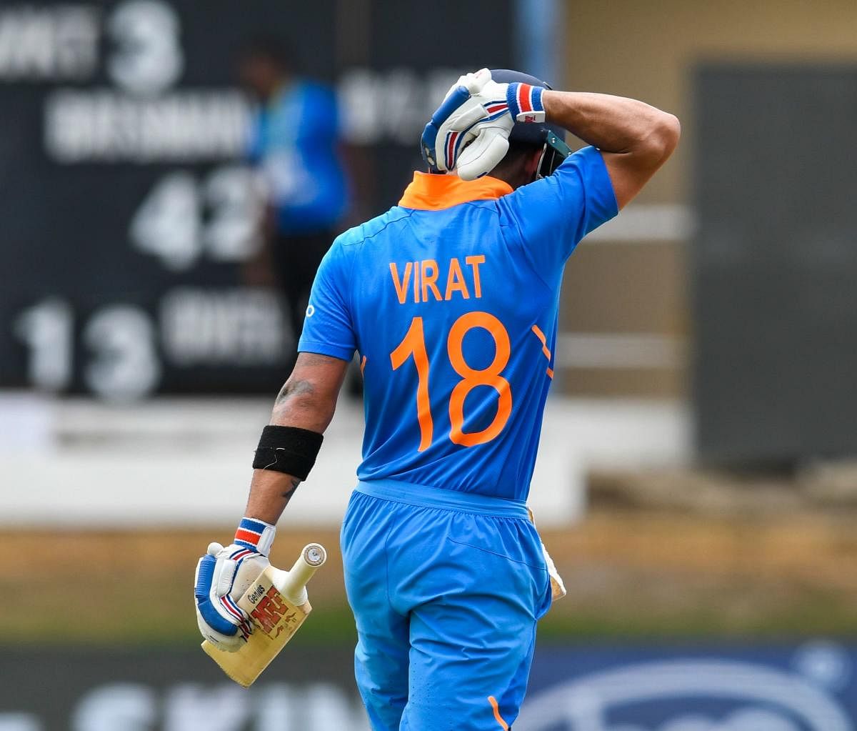 Virat Kohli celebrates his century during the second ODI match between West Indies and India. Photo credit: AFP