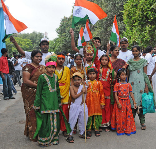 Children celebrate Independence Day by participating in a programme at Kanteerava Stadium in Bangalore on Wednesday. Photo by S K Dinesh