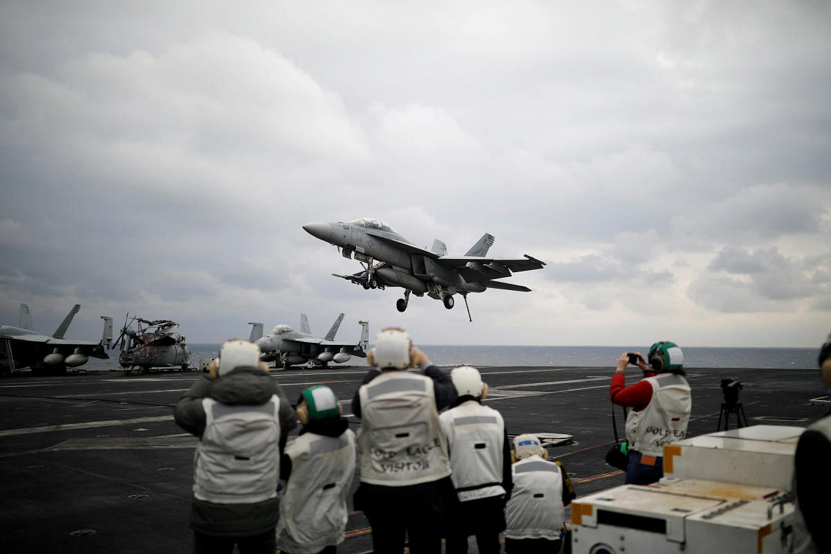 A U.S. F18 fighter jet lands on the deck of U.S. aircraft carrier. (Reuters File Photo)