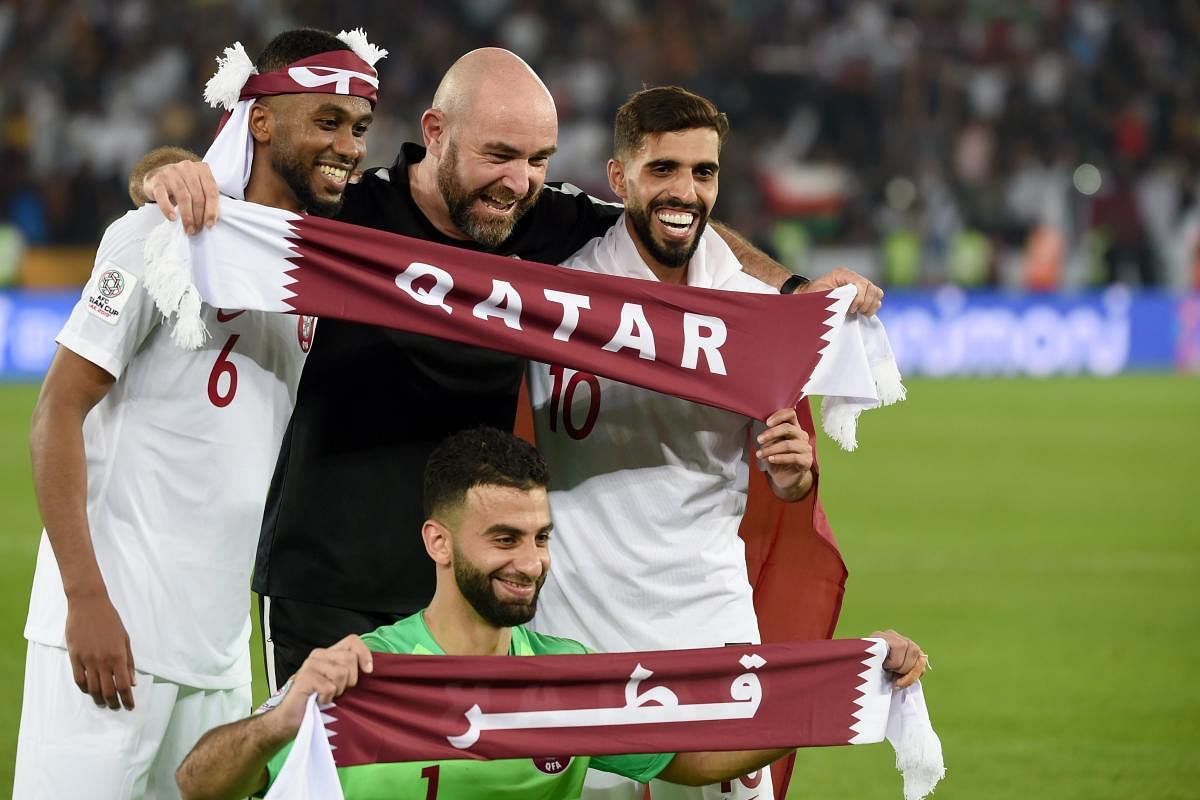 Qatar's coach Felix Sanchez gestures while wearing the gold medal following their win during the 2019 AFC Asian Cup final football match between Japan and Qatar at the Zayed Sports City Stadium. (AFP Photo)