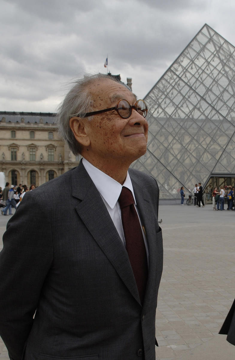 Chinese architect of the Louvre Pyramid Ieoh Ming Pei smiles in the Napoleon courtyard of the Louvre museum in Paris. (AFP File Photo)