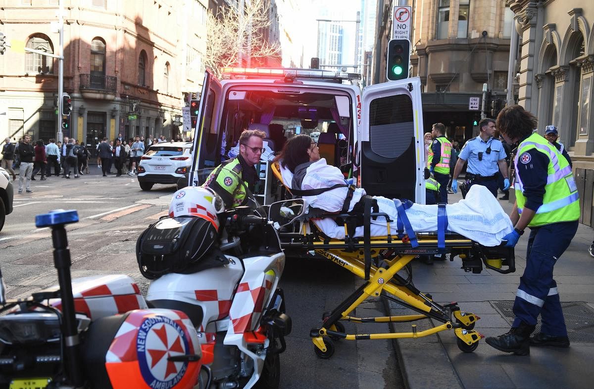 Police and witnesses say a young man yelling about religion and armed with a knife has attempted to stab several people in downtown Sydney before being arrested. AP Photo