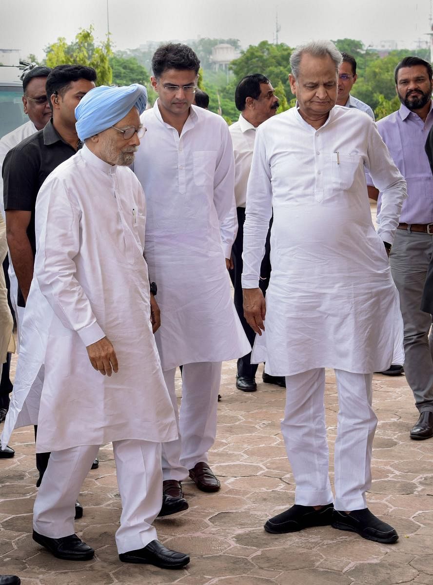 Jaipur: Former prime minister Manmohan Singh with Rajasthan Chief Minister Ashok Gehlot and Dy CM Sachin Pilot arrives to file his nomination papers as a Congress candidate for Rajya Sabha by-election, at the state Assembly in Jaipur, Tuesday, Aug 13, 201