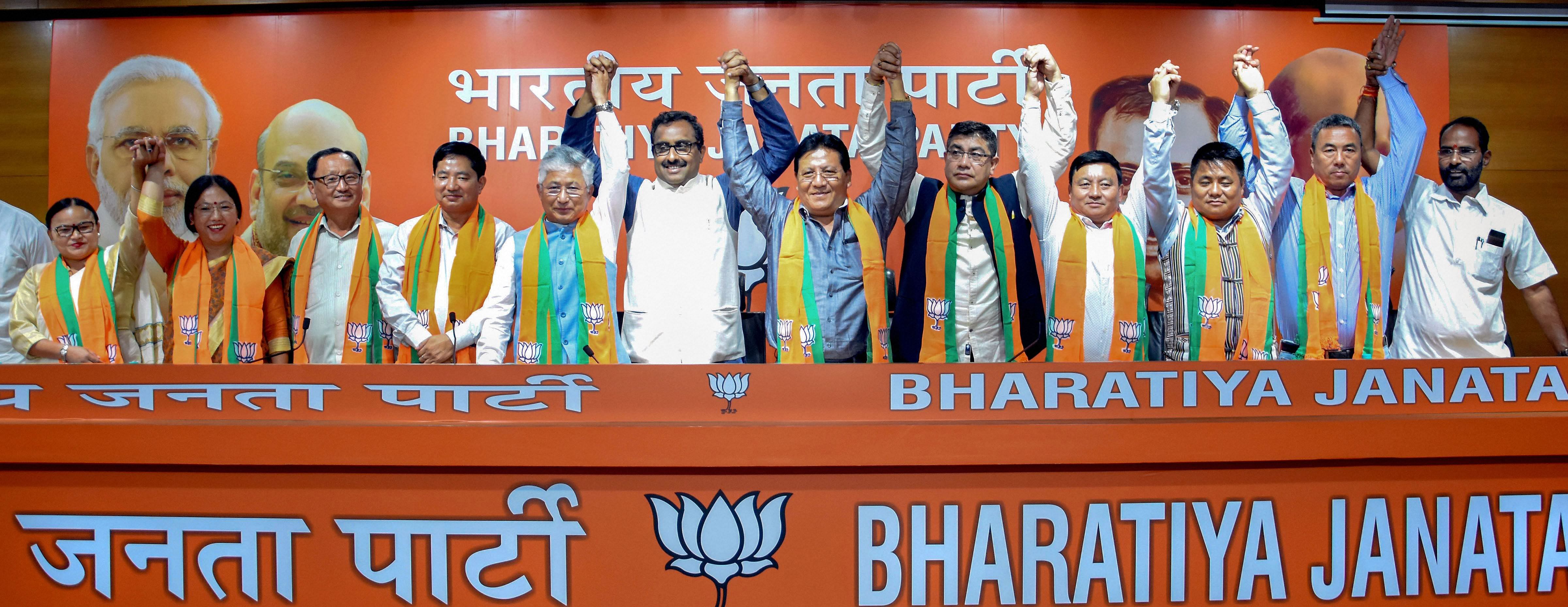 10 Sikkim Democratic Front MLAs join BJP in presence of the party National General Secretary Ram Madhav in New Delhi. (PTI Photo)