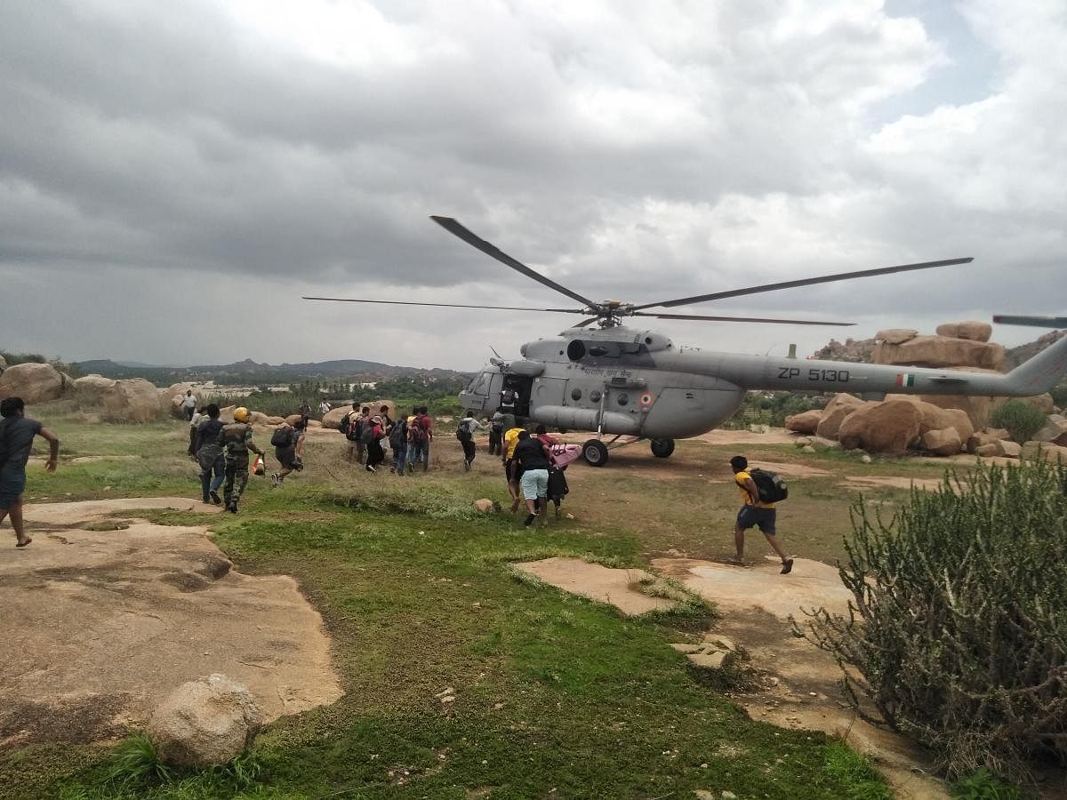 Tourists, who were stranded in Virupapura Gaddi, were rescued with the help of an Army helicopter on Tuesday. DH photo