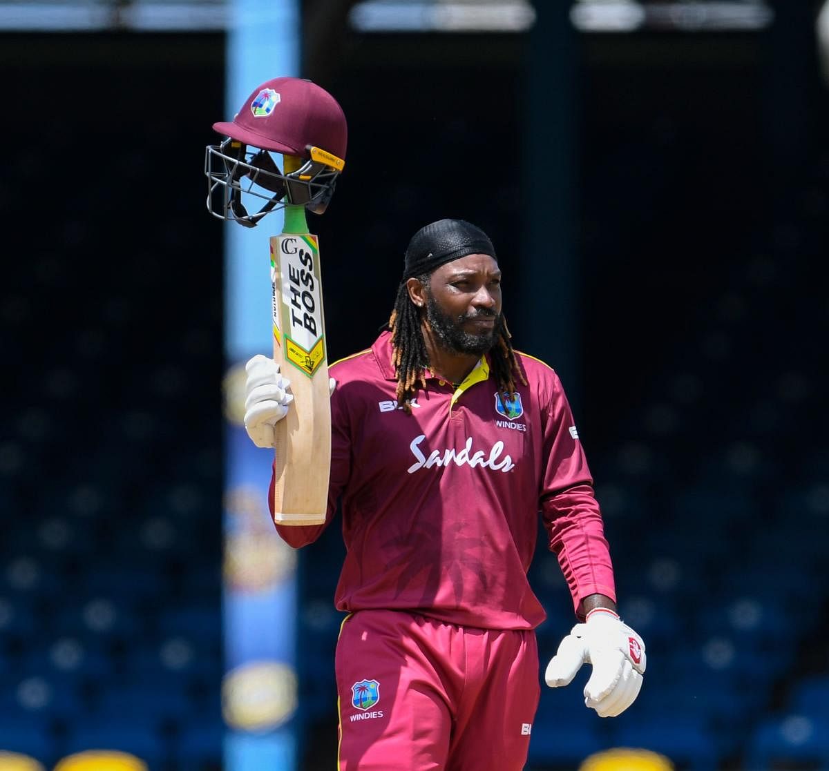 Chris Gayle celebrates his half-century during the 3rd ODI match between West Indies and India. Photo credit: AFP