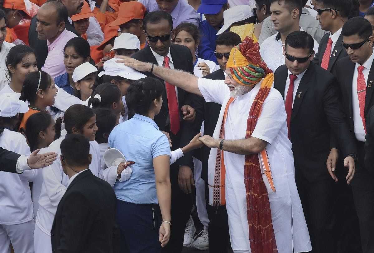 Prime Minister Narendra Modi meets school children after addressing the nation from the ramparts of the historic Red Fort on the occasion of 73rd Independence Day, in New Delhi. (PTI Photo)