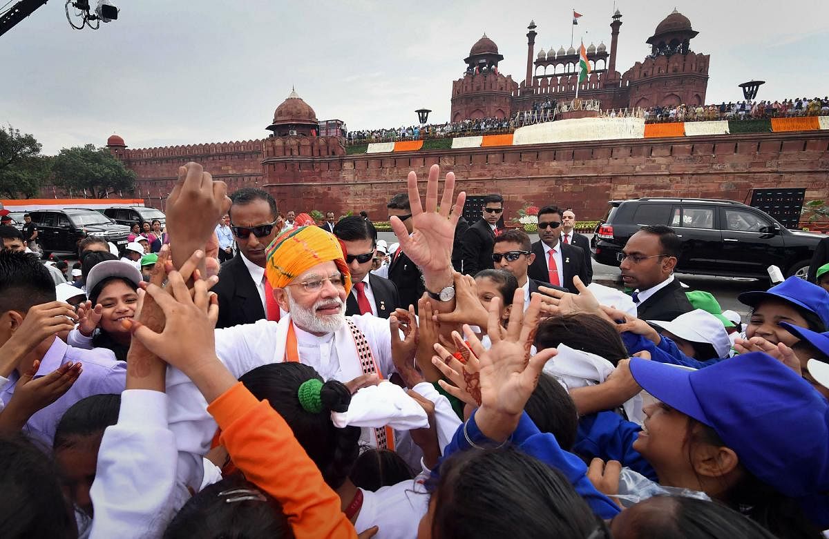 New Delhi: Prime Minister Narendra Modi interacts with the schoolchildren after addressing the nation from the ramparts of Red Fort on the occasion of 73rd Independence Day, in New Delhi, Thursday, August 15, 2019. (PIB/PTI Photo) (PTI8_15_2019_000156B)
