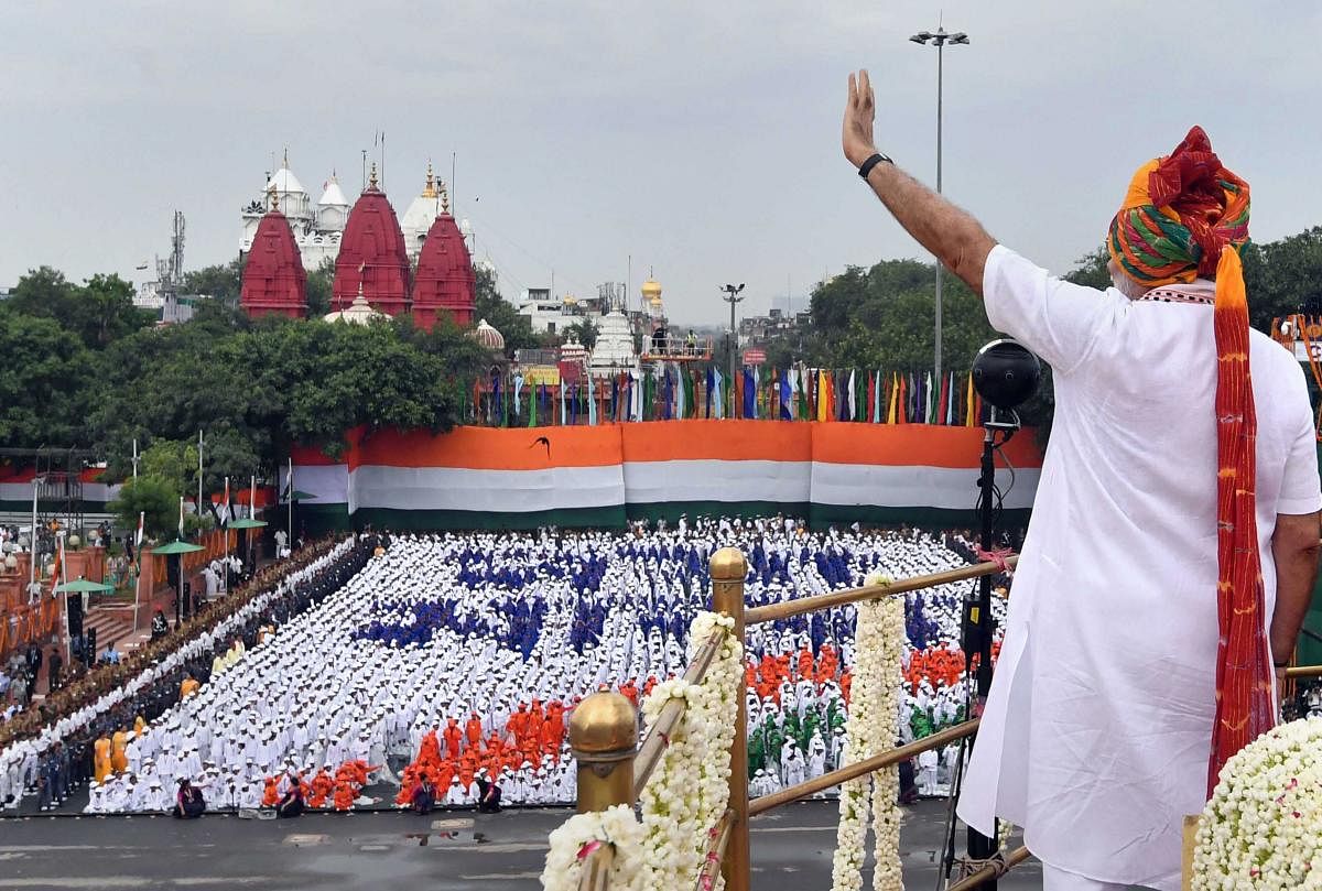 Prime Minister Narendra Modi waves at the crowd as he arrives to address the nation from the ramparts of Red Fort on the occasion of 73rd Independence Day, in New Delhi, Thursday, August 15, 2019. (PIB/PTI Photo)