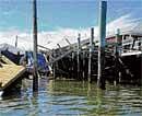 Lull After The Storm A collapsed building and dock remains after Tropical Storm Irene, at the Queens borough in New York.  (photo: Robert StolariK/NYT)