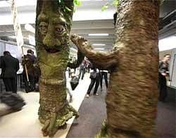 Activists from Avaaz.org dressed as trees hold an event in the main hall of the Bella Center during the Climate Change Conference in Copenhagen. Reuters