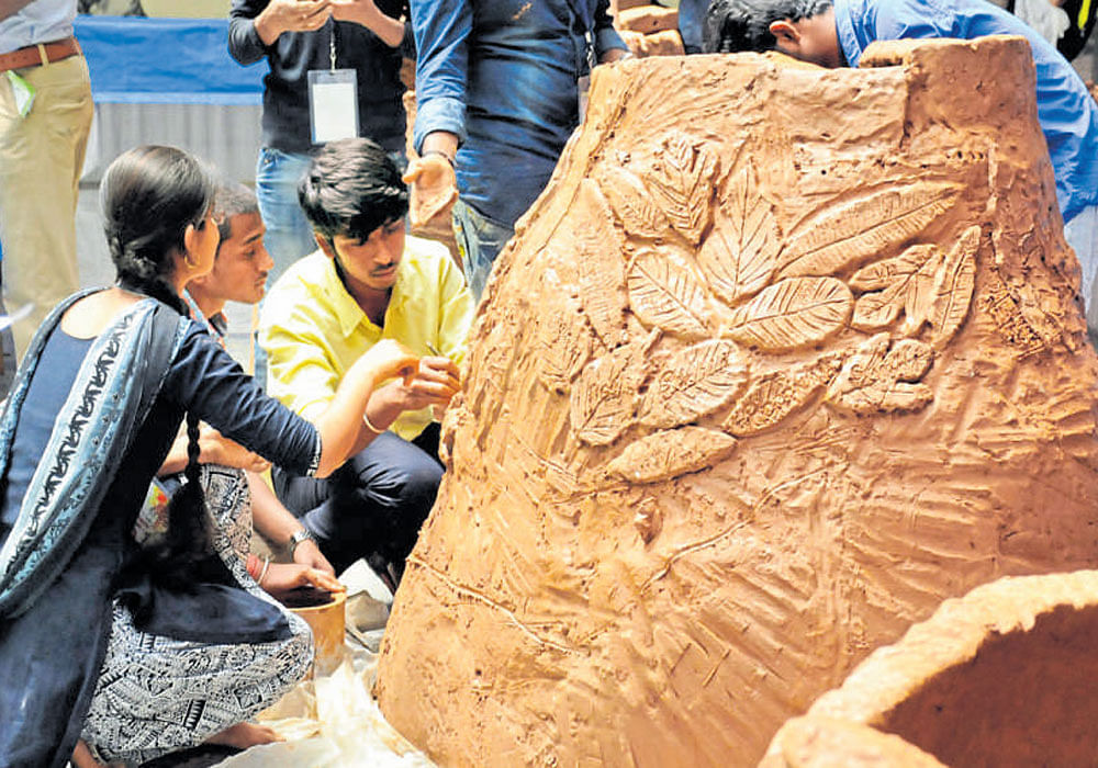 Students make clay models on the first day of the 13th  Agricultural Science Congress at the University of Agricultural Sciences in Bengaluru on Tuesday. DH&#8200;photo