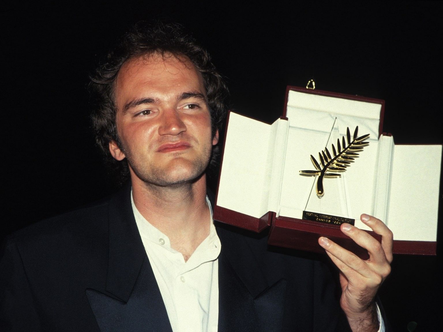 Quentin Tarantino with the Palme d'Or that he won for 'Pulp Fiction' in 1994.