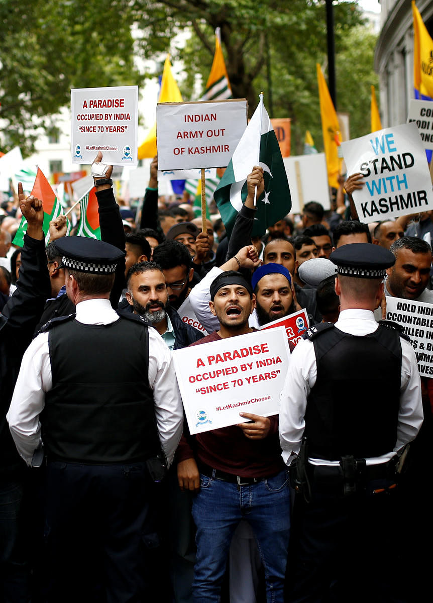 Demonstrators protest the scrapping of the special constitutional status in Kashmir by the Indian government, outside the Indian High Commission in London. (Photo by Reuters)