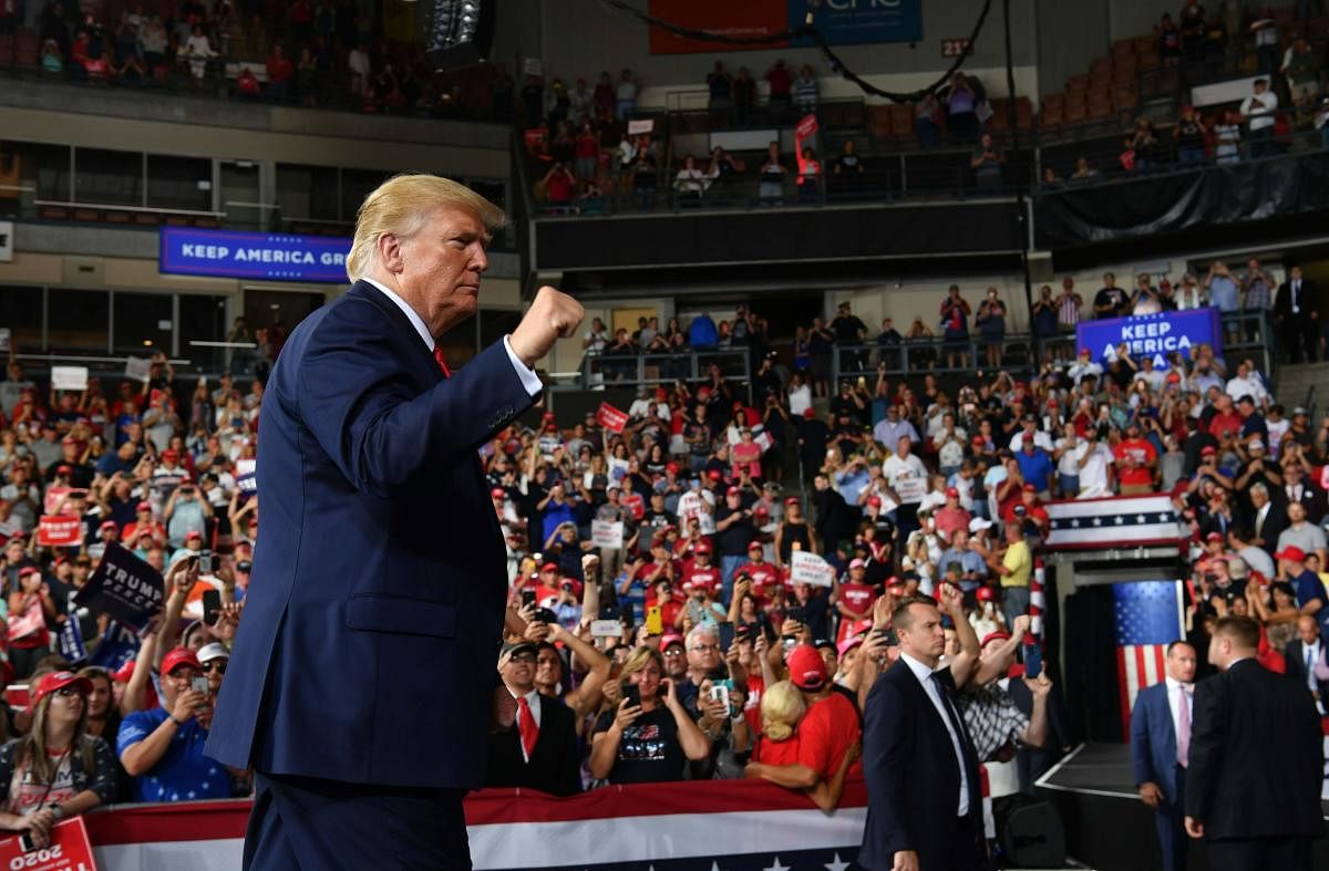 US President Donald Trump walks off stage after a "Keep America Great" campaign rally at the SNHU Arena in Manchester, New Hampshire, on August 15, 2019. AFP