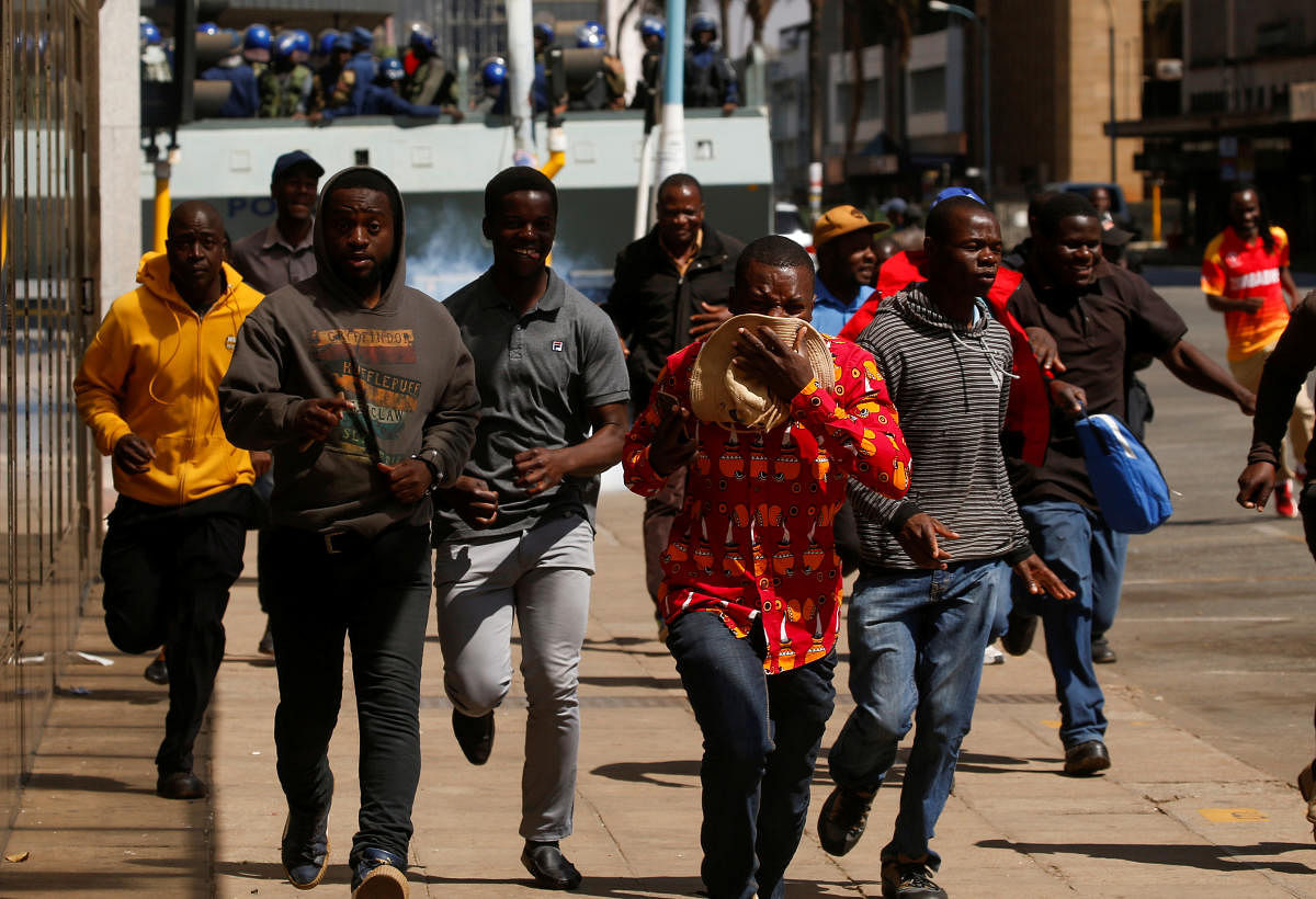 Protesters flee from teargas during clashes after police banned planned protests over austerity and rising living costs called by the opposition Movement for Democratic Change (MDC) party in Harare, Zimbabwe, August 16, 2019. (Reuters Photo)