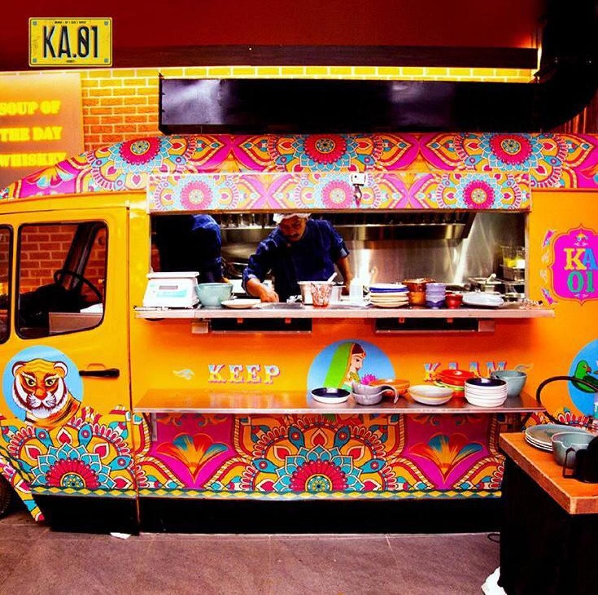 The kitchen is a colourful caravan.