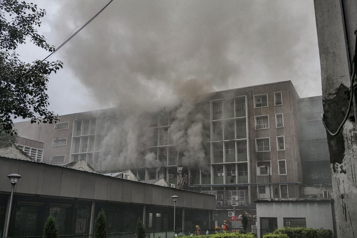 Smoke billows out as fire personnel douse fire which broke out at the teaching block of the All India Institute of Medical Sciences (AIIMS) in New Delhi, Saturday, Aug 17, 2019. (PTI Photo)