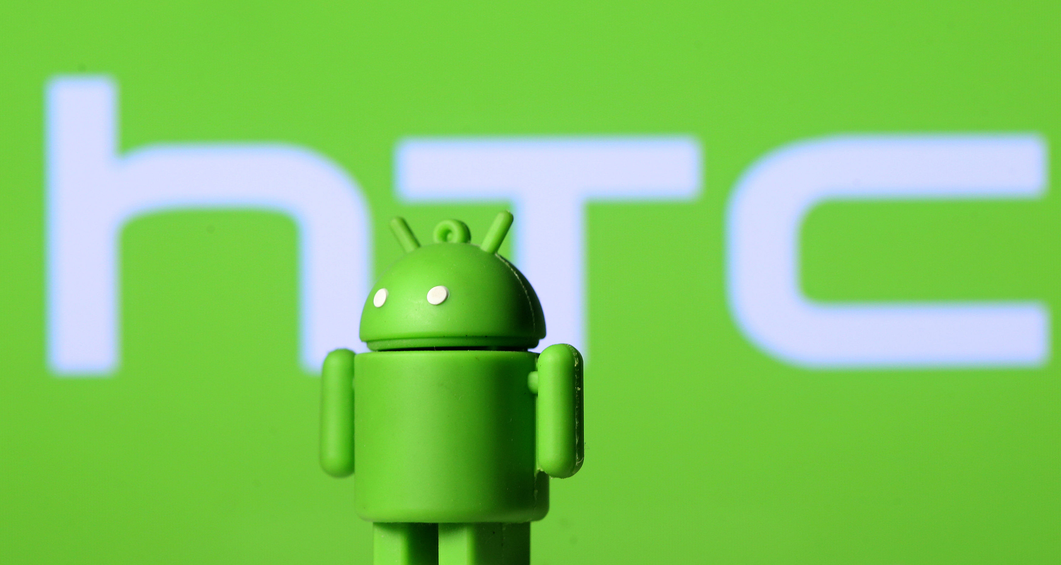 Android toy infront of HTC logo (REUTERS/Dado Ruvic/Illustration)