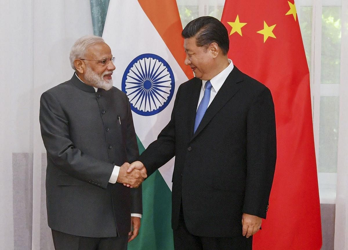  Prime Minister Narendra Modi shakes hands with Chinese President Xi Jinping on the sidelines of the Shanghai Cooperation Organisation (SCO) Summit in Bishkek, Kyrgyzstan, Thursday, June 13, 2019. (Twitter/PTI Photo) 