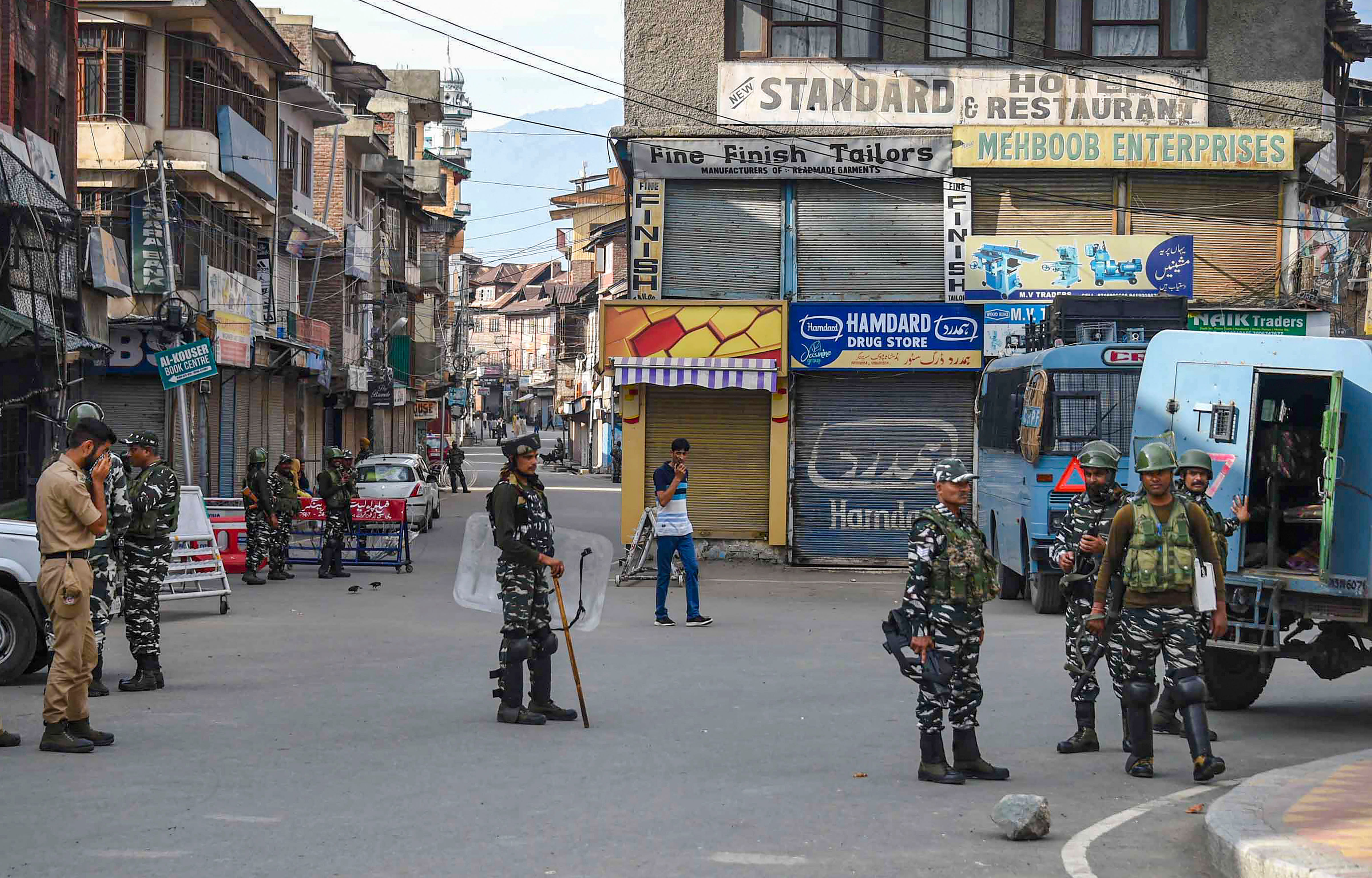 Security personnel stand guard during restrictions following the abrogation of the provisions of Article 370, in Srinagar. (PTI Photo)