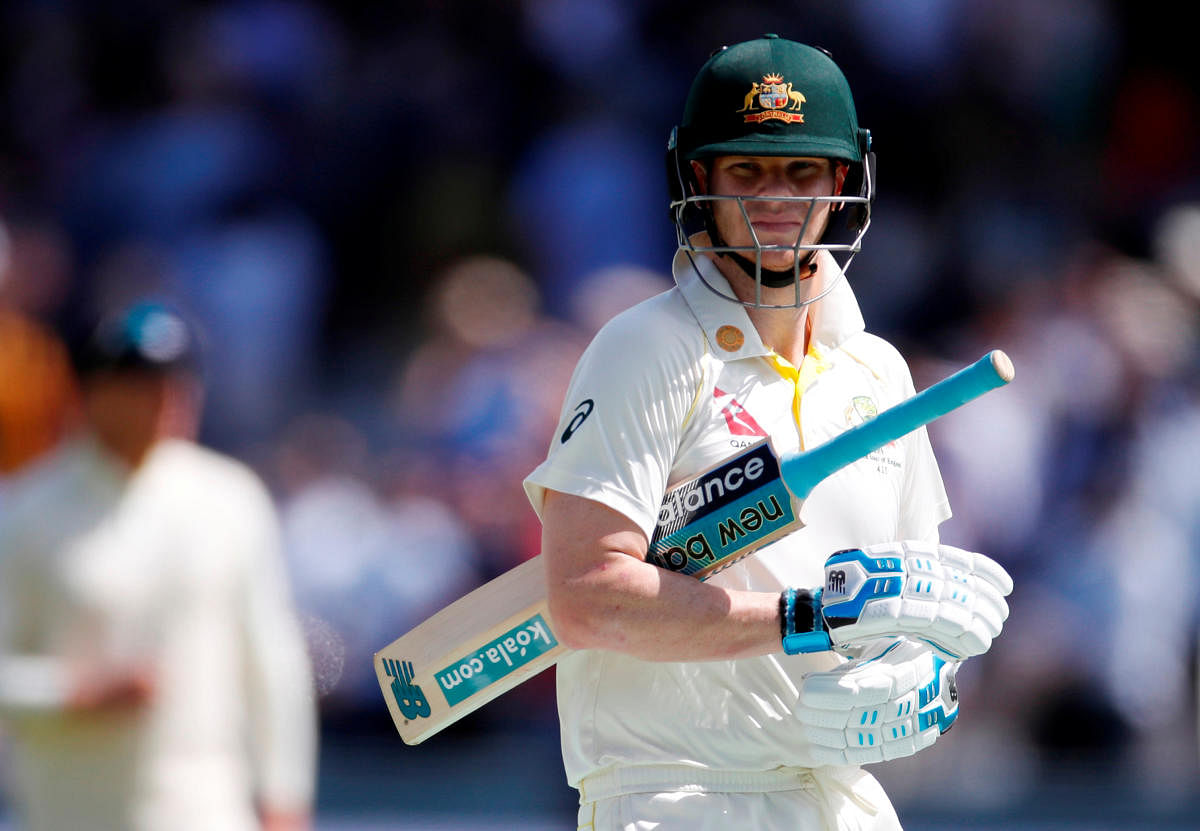 Smith, who made 144 and 142 in Australia's emphatic victory in the first test, moved on to 53 not out with Tim Paine unbeaten on 21 and the touring side trailed by 103 runs in the rain-affected match. (Reuters photo)