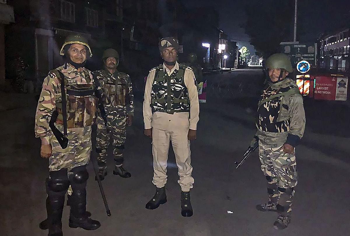  Srinagar: CRPF jawans stand guard in downtown Srinagar, Saturday-Sunday intervening night, Aug 17, 2019. (PTI Photo/Sumir Kaul)