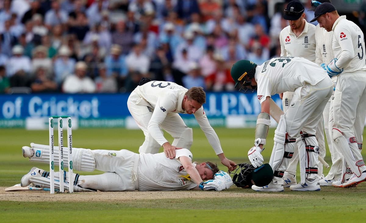 Australia's Steve Smith lays on the pitch after being hit in the head by a ball off the bowling of England's Jofra Archer. (AFP photo)