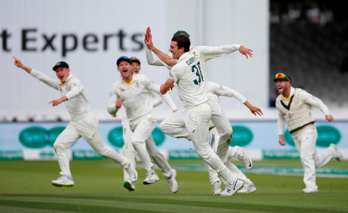 Australia's Pat Cummins celebrates taking the wicket of England's Joe Root. (Reuters file photo)