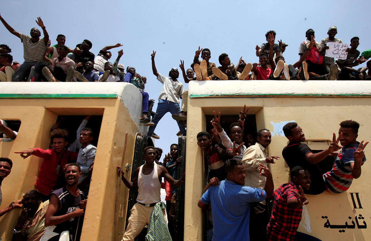 Sudanese civilians ride on the train to join in the celebrations of the signing of the Sudan's power sharing deal. (Reuters file photo)