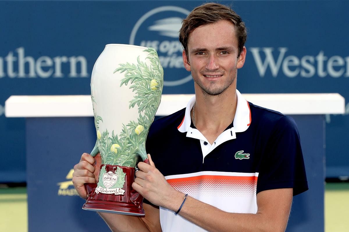 Daniil Medvedev of Russia poses for photographers after defeating David Goffin of Belgium. (AFP images)