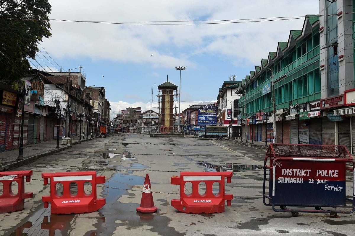 The clock tower at deserted Lal Chowk is pictured during a security lockdown in Srinagar on Monday. AFP