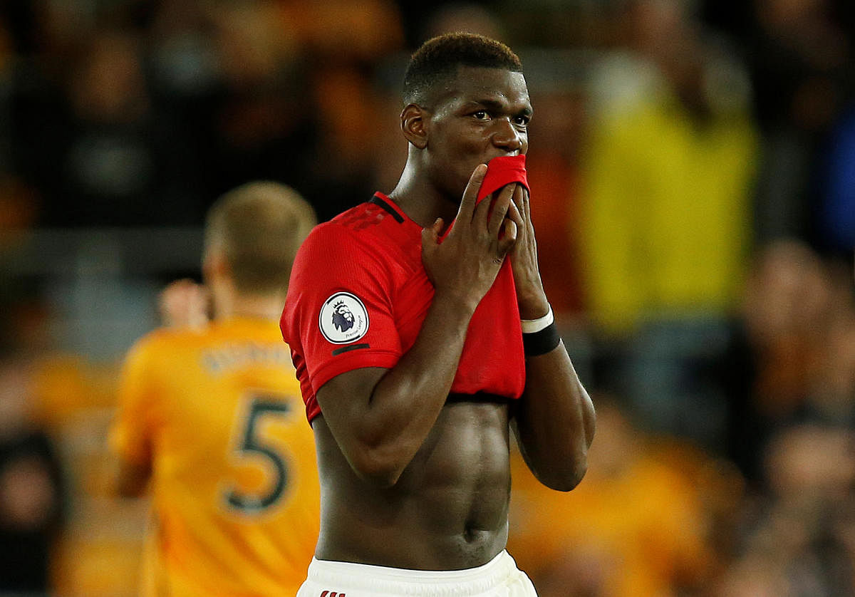 Pogba won the second-half penalty but failed to convert it as Rui Patricio dived to his left to make the stop, denying United a chance at victory (Reuters Photo)