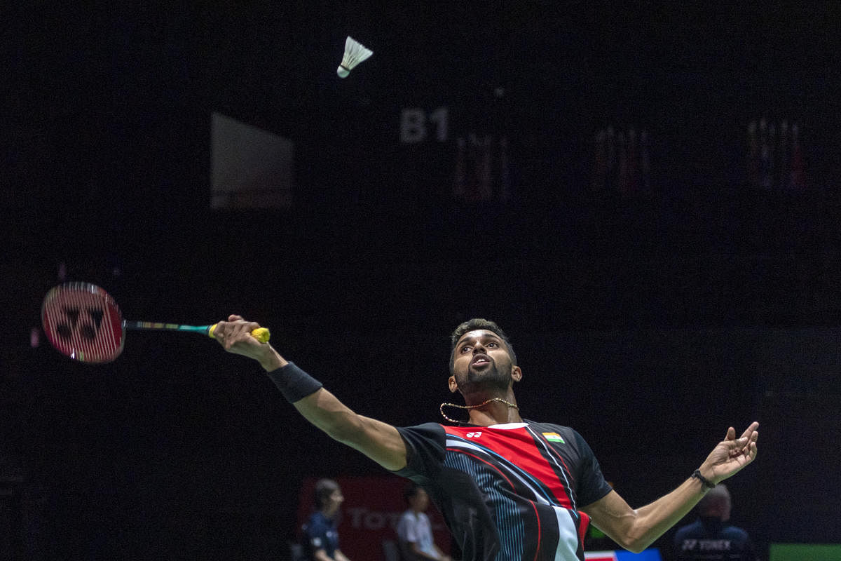 India's H.S. Prannoy returns a shuttlecock to China's Lin Dan during their men's singles second-round match at the BWF Badminton World Championships in the St. Jakobshalle in Basel, Switzerland. (PTI Photo)