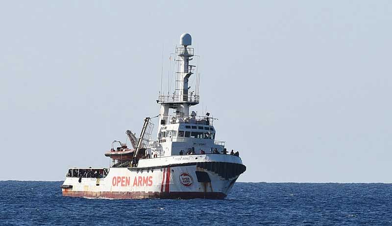 The boat had spent six days anchored off Lampedusa before a local prosecutor on Tuesday ordered their disembarkment amid a probe of far-right Interior Minister Matteo Salvini for forbidding their entry to the port. (Reuters Photo)