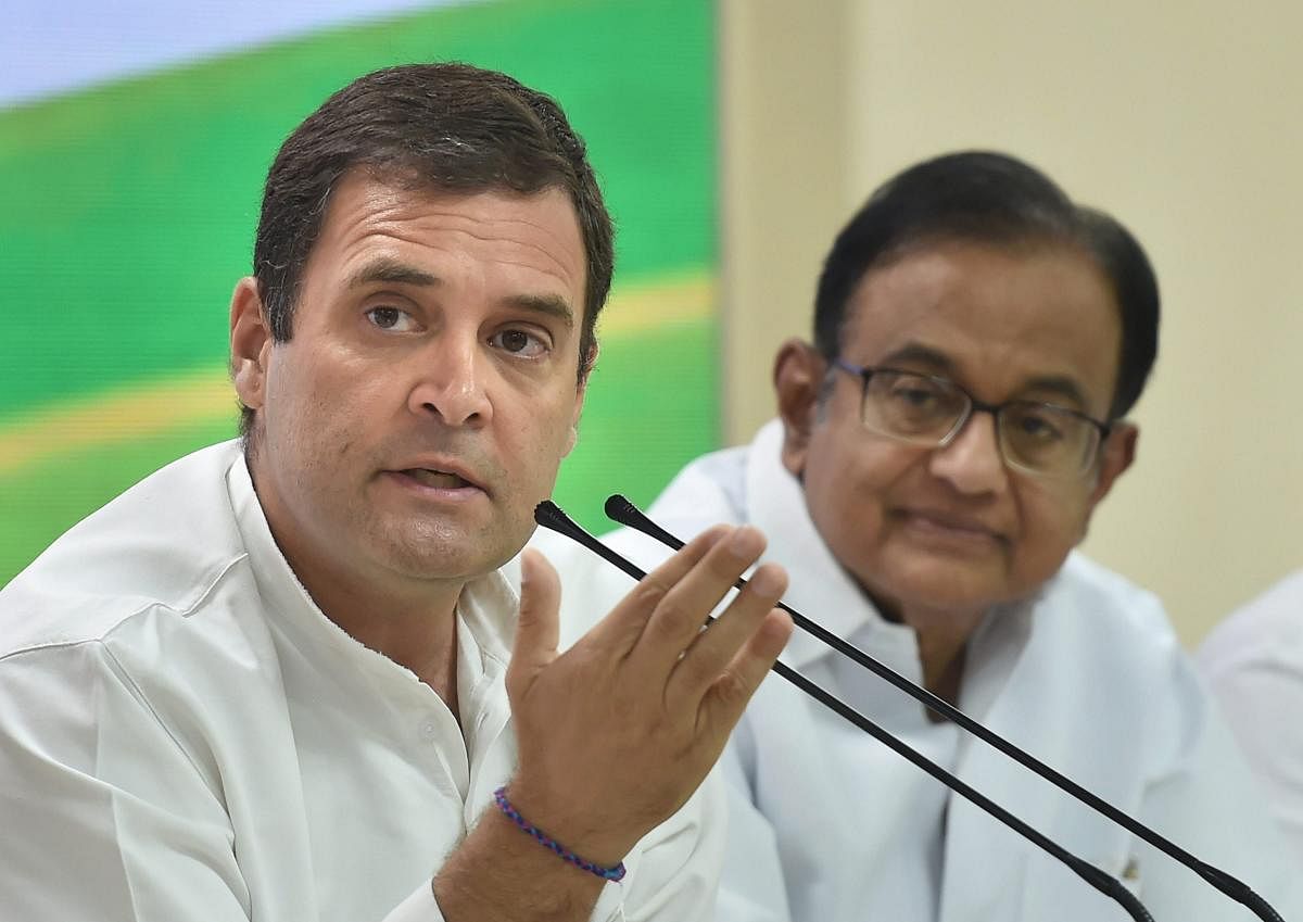 Former Congress President Rahul Gandhi addresses a press conference as senior party leader P Chidambaram looks on. (PTI Photo)