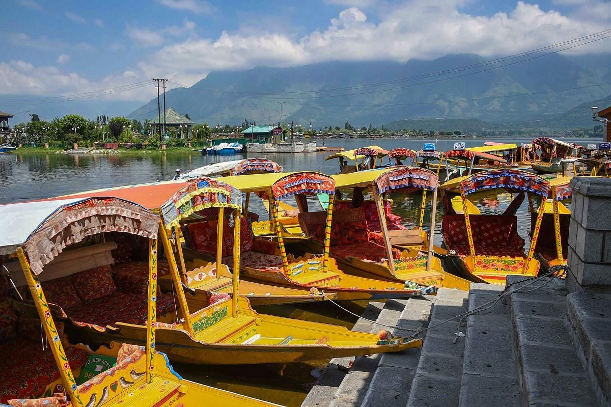 Shikaras lay abandoned at a ghat as restrictions continue in the Valley, at Dal Lake in Srinagar, on August 18, 2019. PTI