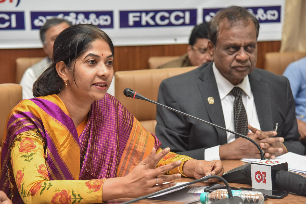 Shikha C, Managing Director, BESCOM, speaks at an interactive meeting organised by the Federation of Karnataka Chambers of Commerce and Industry (FKCCI) in Bengaluru on Tuesday. DH PHOTO/S K Dinesh