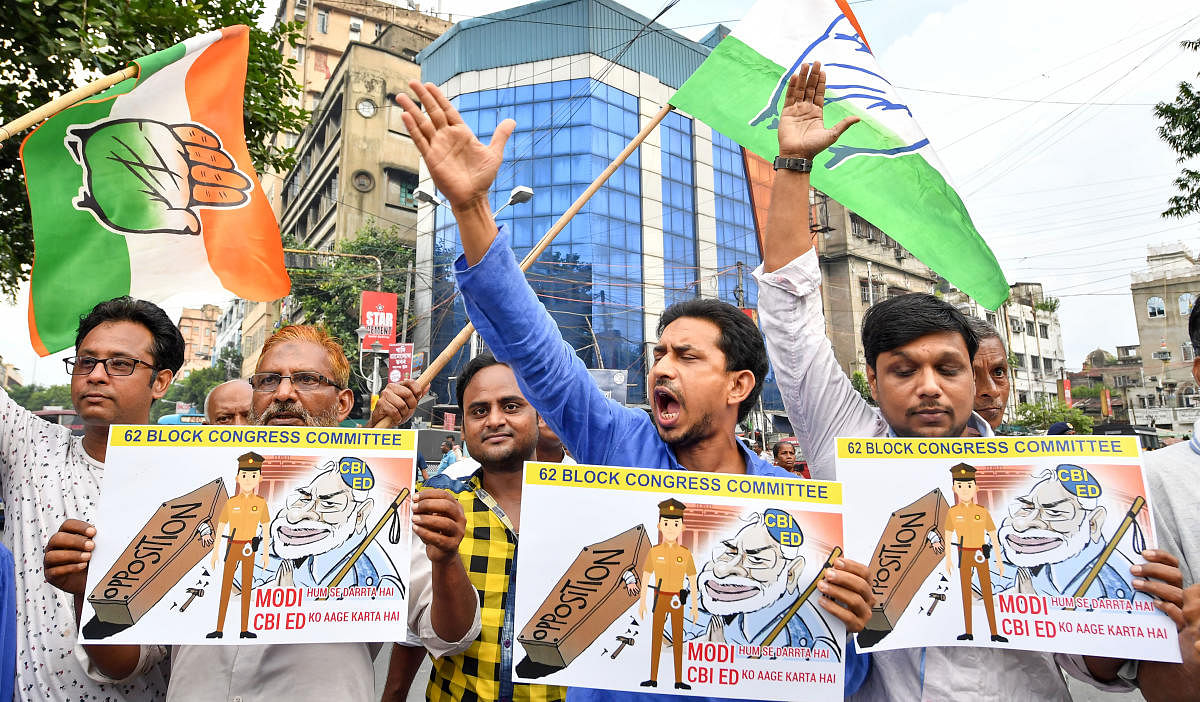 Congress workers shout slogans during a protest against the arrest of the party leader P Chidambaram, in Kolkata, Thursday, August 22, 2019. (PTI Photo)