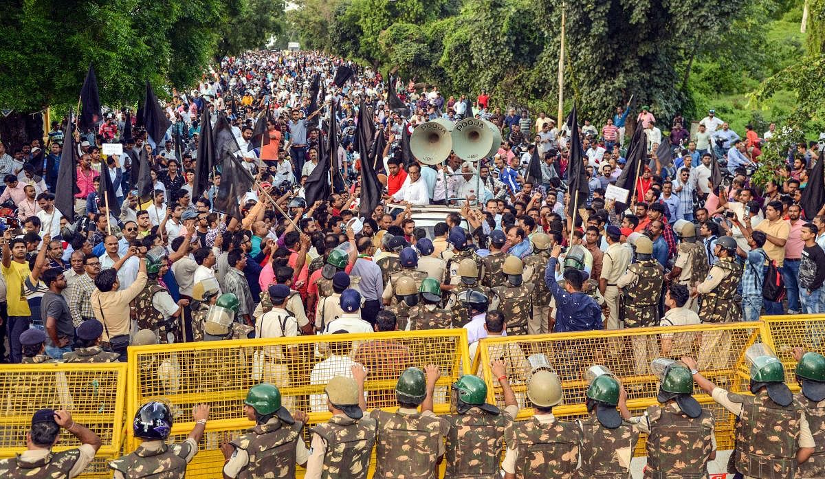 All India employees take part in a protest rally against the Central government over the proposed privatization of 41 ordnance factories in Jabalpur. (PTI Photo)
