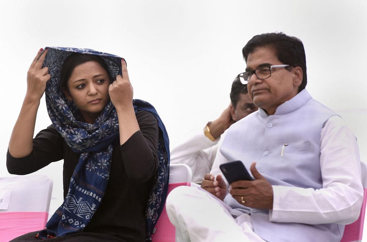 Activist Shehla Rashid and Samajwadi Party leader Ram Gopal Yadav during opposition parties' protest demanding the release of leaders detained in J&amp;K, at Jantar Mantar in New Delhi. PTI photo