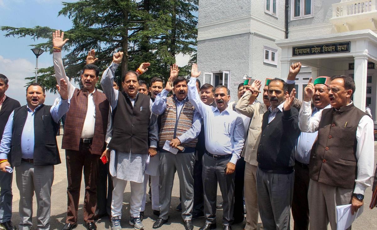 Congress leader Mukesh Agnihotri and other party leaders protest in support of former union minister P Chidambaram, against his arrest by CBI in the INX media case, outside Vidhan Sabha in Shimla. PTI photo