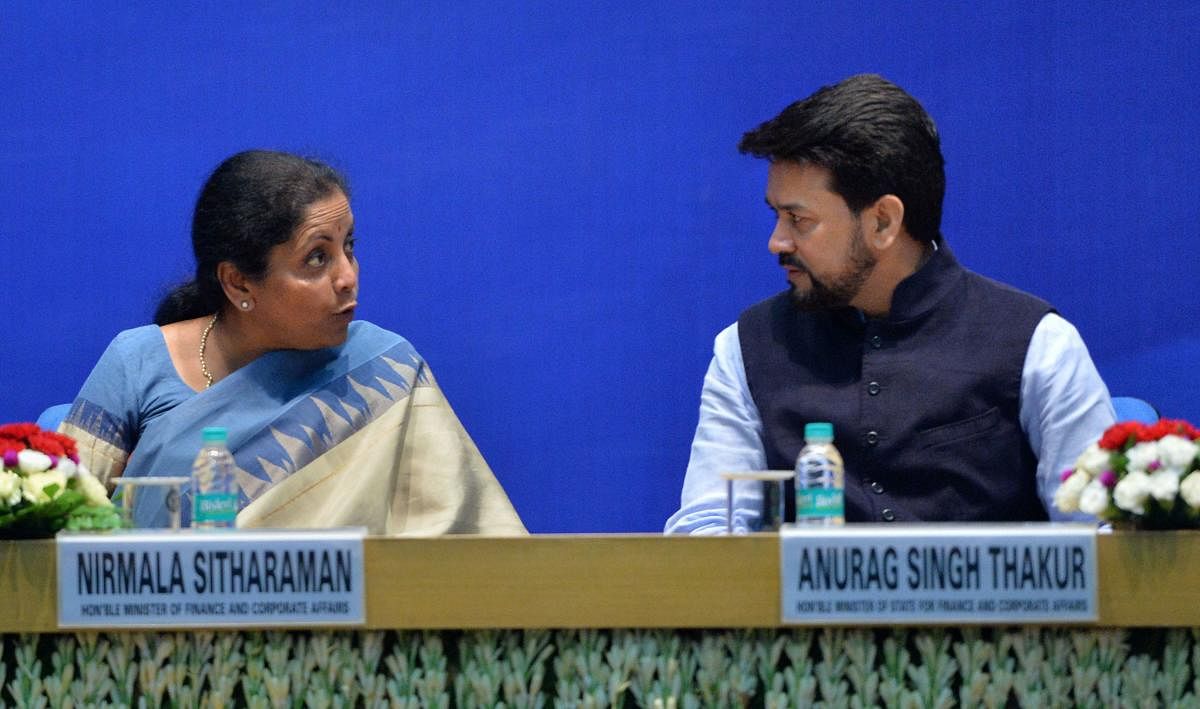 Finance Minister Nirmala Sitharaman and MoS for Finance Anurag Thakur during a function to celebrate 'Ten Years of Competition Law Enforcement' at DRDO Bhawan, in New Delhi on Friday. PTI photo