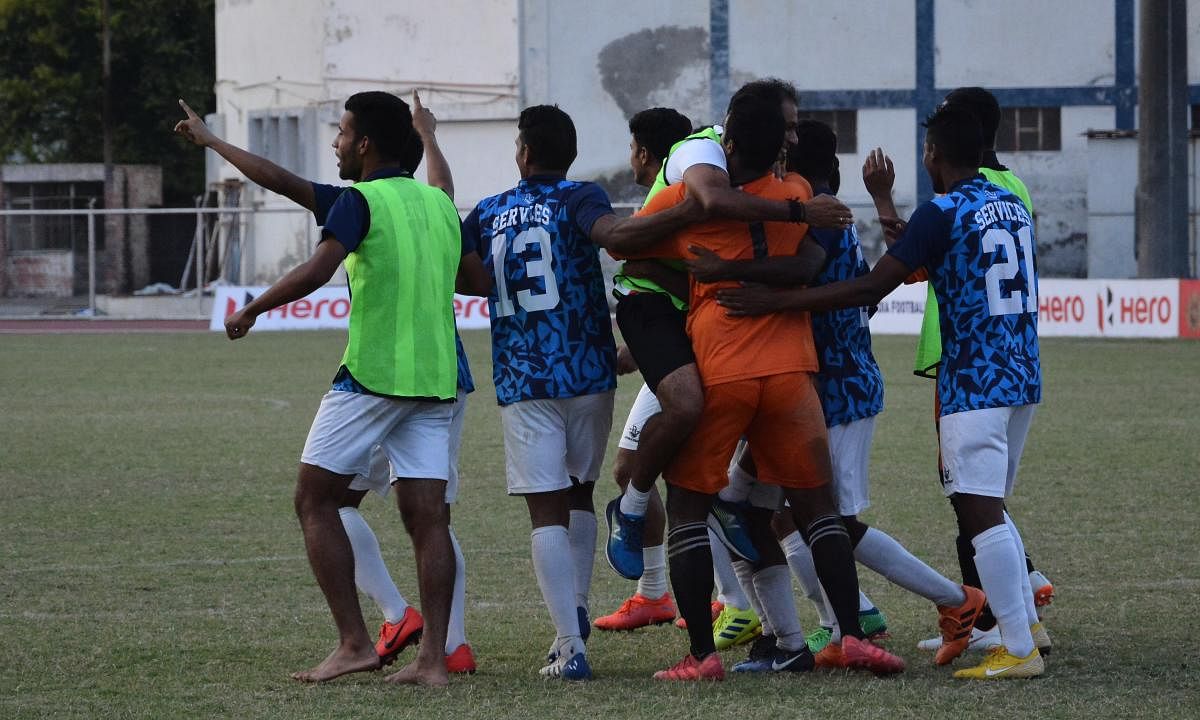 THRILLED: Services players celebrate after defeating Karnataka in the semifinal in Ludhiana on Friday. AIFF