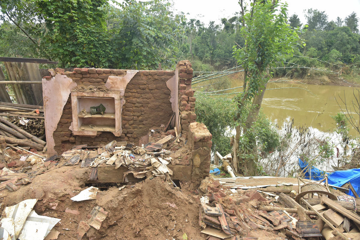 This collapsed house on the river bank at Karadikodu in Virajpet taluk of Kodagu districtis a tell-tale sign of disaster. A study by EMPRI shows that encroachment and construction activities in the 300-meter buffer zone on either side of the river pose a