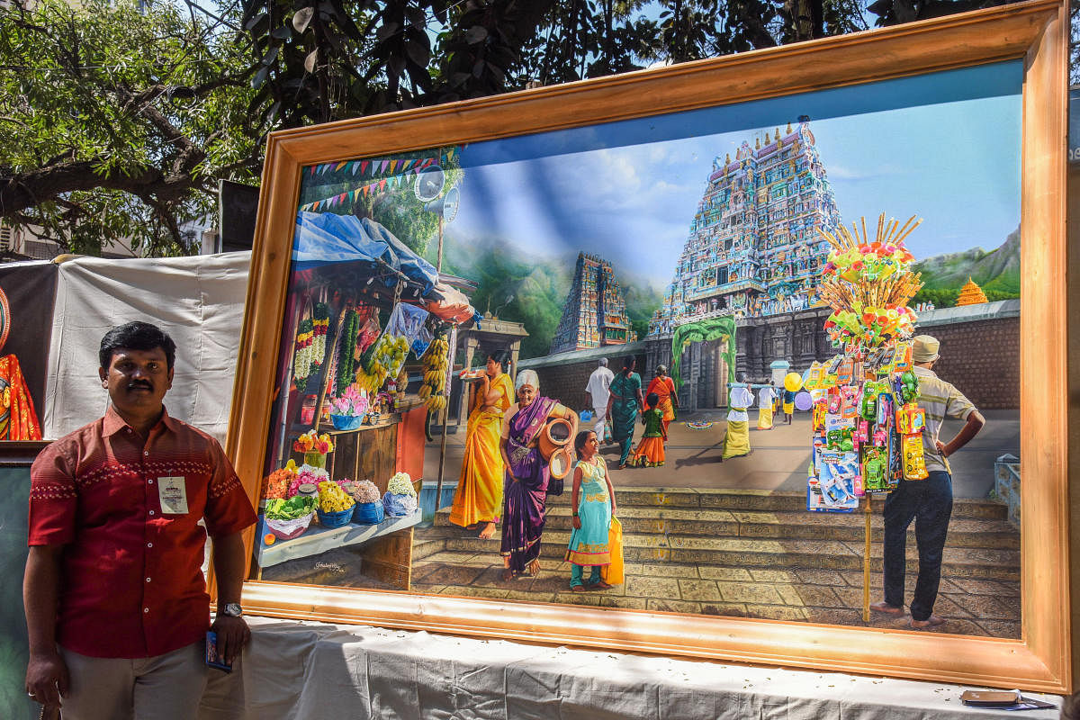 Gokulam Vijay, artist from Coimbatore, exhibits his painting that costs Rs 12 lakh at the fair. DH Photo/S K Dinesh