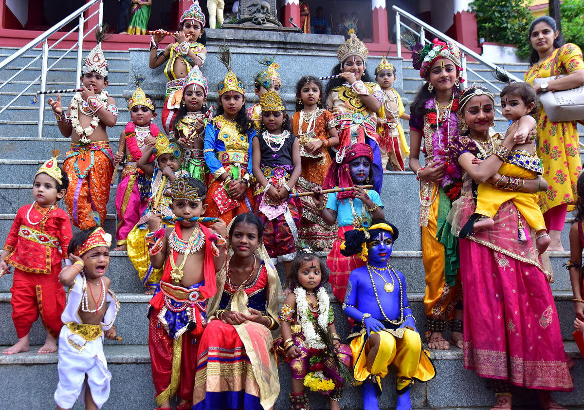 Children dressed as Krishna and Radha pose for a photograph at Sri Manjunatha Temple in Kadri in Mangaluru on Friday. 